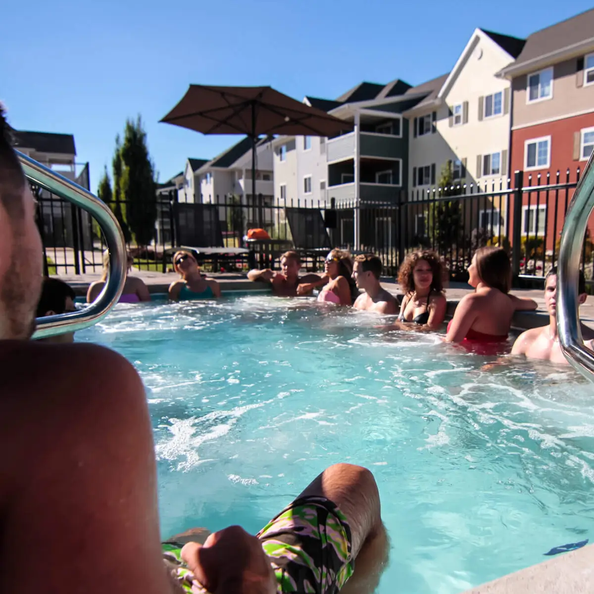 young residents relaxing in the community pool